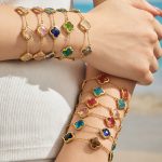 Light Luxury Four-Leaf Flower Inlaid Ice Stone Clavicle Chain Stainless Steel Gold-Plated Women's Bracelet Necklace Jewelry Three-Piece Set