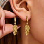 Golden wing pendant earrings, stainless steel, vintage high-end ear jewelry—available now.