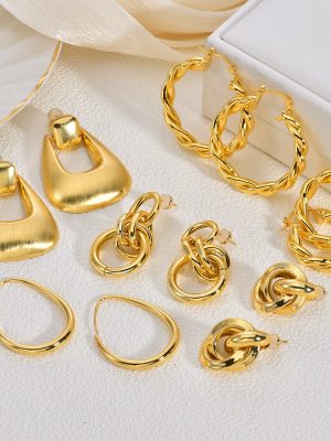 Large hoop copper earrings, golden earrings for women, designer chic ear studs, U-shaped hoops, exquisitely crafted and subtly luxurious.
