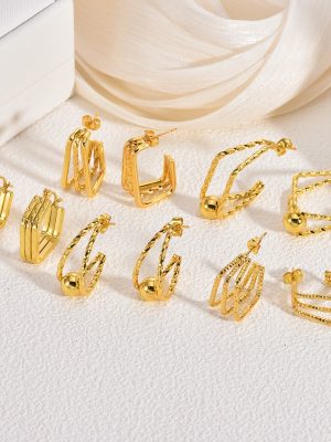 Vintage ornament stainless steel earrings, light luxury high-end exaggerated earrings for women, designer gold stud earrings.
